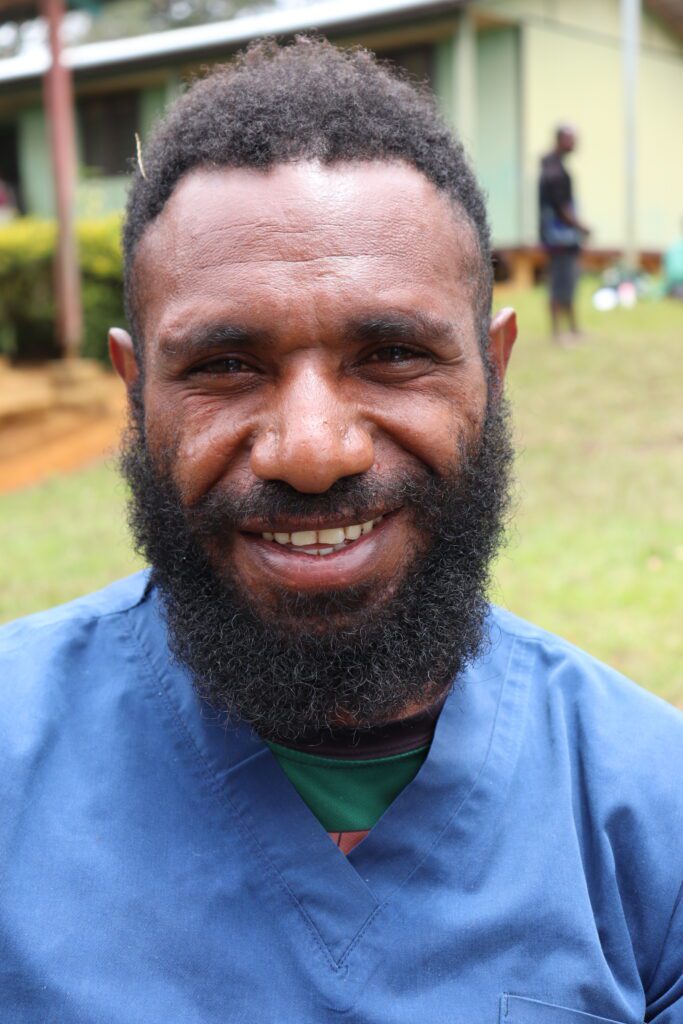 Health worker Jeffery Lucas keeps John stable until MAF arrives (credit: Kowara Bell)