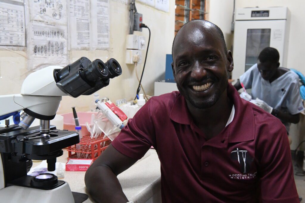 William Deng carries out a range of blood, urine and stool tests in the lab (credit: Jenny Davies)