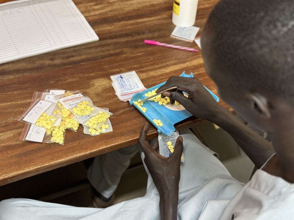 Medication flown in by MAF is carefully dispensed by IDAT’s team (credit: Jenny Davies)