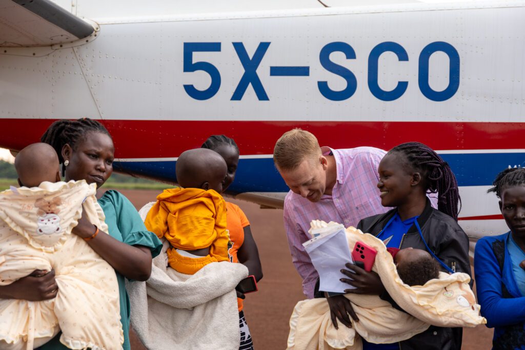 Tim Erickson welcomes 1st 5 babies to benefit from collaboration in Dec 2023 (credit: C.Waniala/CURE)