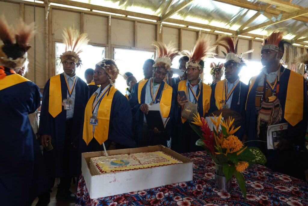 Year 12 graduates gather around their celebratory cake (credit: Mandy Glass)