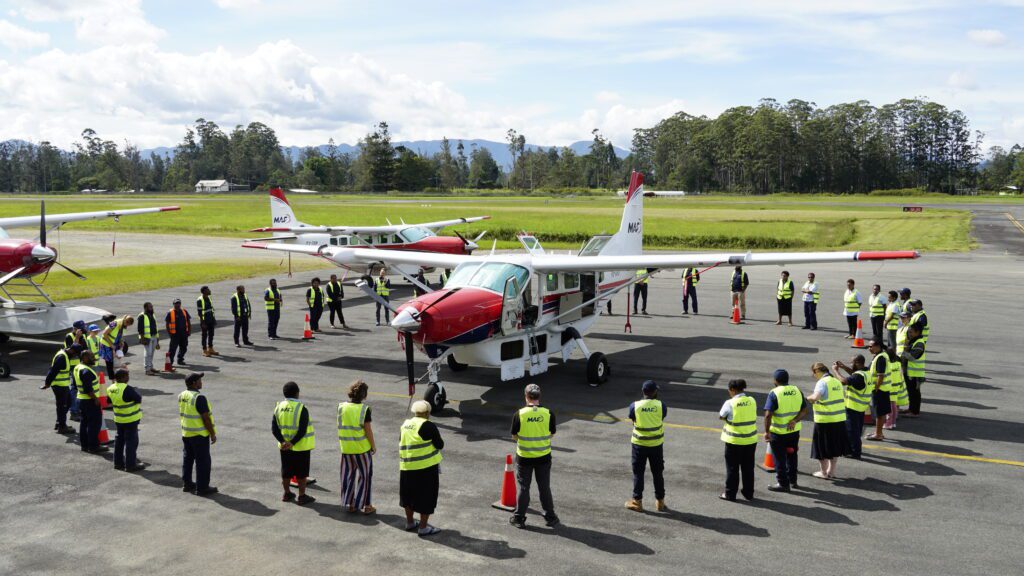 The new aircraft is encircled by prayer warriors (credit: Mandy Glass)