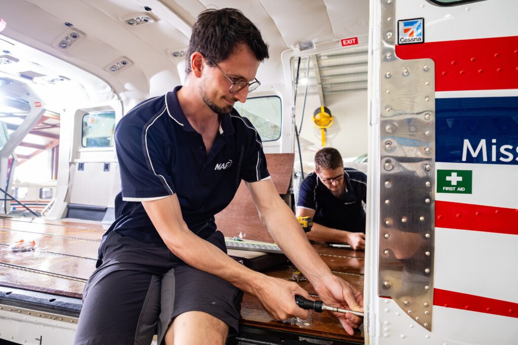 MAF engineers Mirco Luck (L) & Philemon Buchs (R) adapt the plane for PNG (credit: Janne Rytkonen) 
