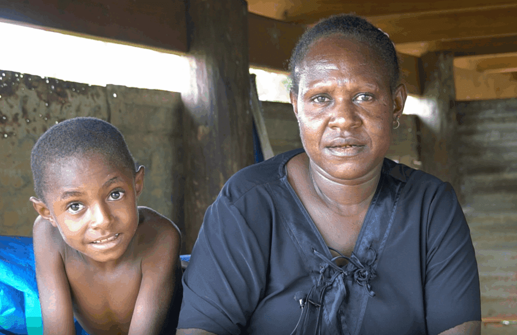 Student Esther (R) benefits from the tablet & coursework that P2-WET delivers (credit: Aquila Matit)