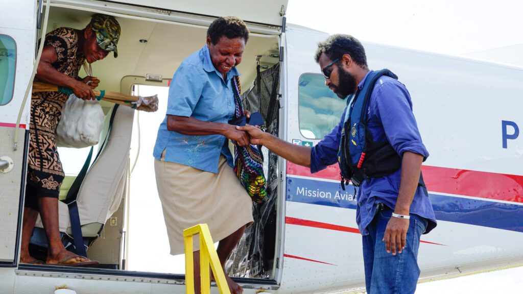 School head Esthel Babare is the 1st person from Usukof to board the floatplane (credit: Aquila Matit)