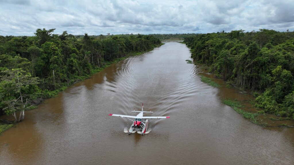 The floatplane lands on water near Kapikam Village (credit: Terry Fahey)