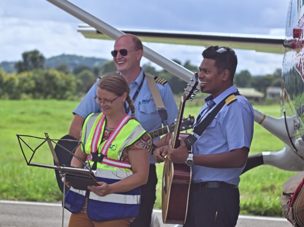 L to R: Mark was serenaded by Peter Griffin, Paivi Griffin & Roshan Stephen (credit: Matt Dillingham) 