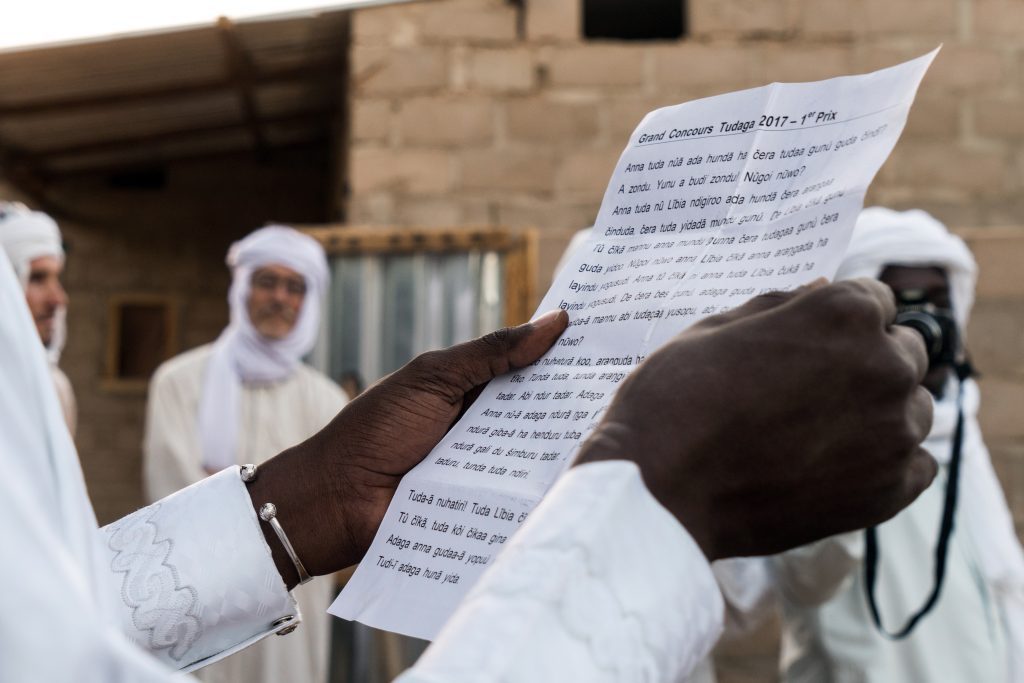 Amina's essay in Teda is read out to the audience (credit: LuAnne Cadd)