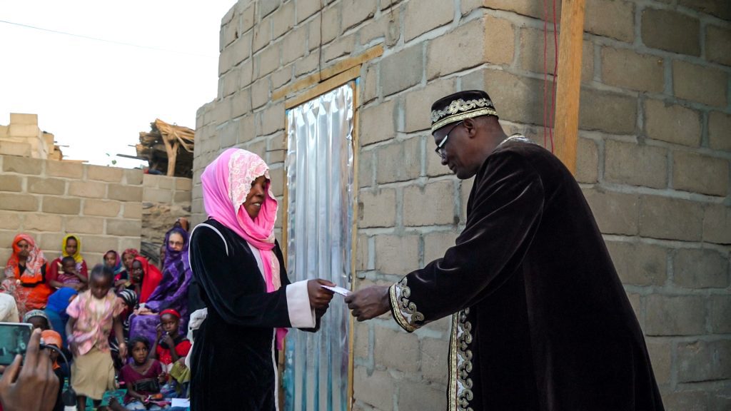 Amina is awarded top prize by the regional governor (credit: LuAnne Cadd)