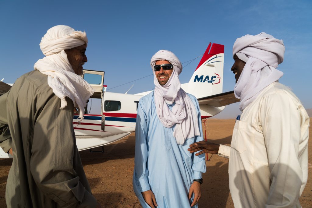 Mark Ortman (L) greets Rivers Camp (C) & Mohamed Abakar (R) (credit: LuAnne Cadd) 