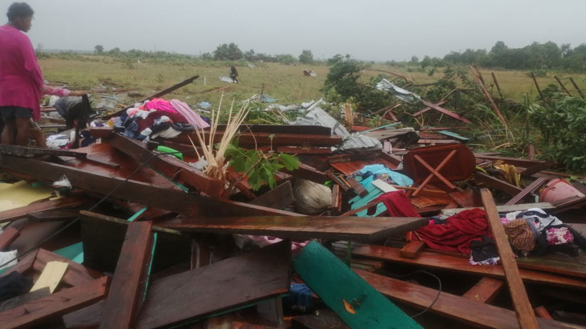 Hurricane Iota totally destroys house in Brus Laguna on the north east coast of Honduras as local woman looks on 