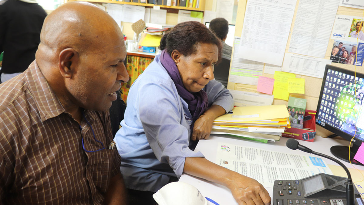 Dr James Gahare (L) from the Eastern Highlands Provincial Health Authority conveying important Covid-19 info over the airways