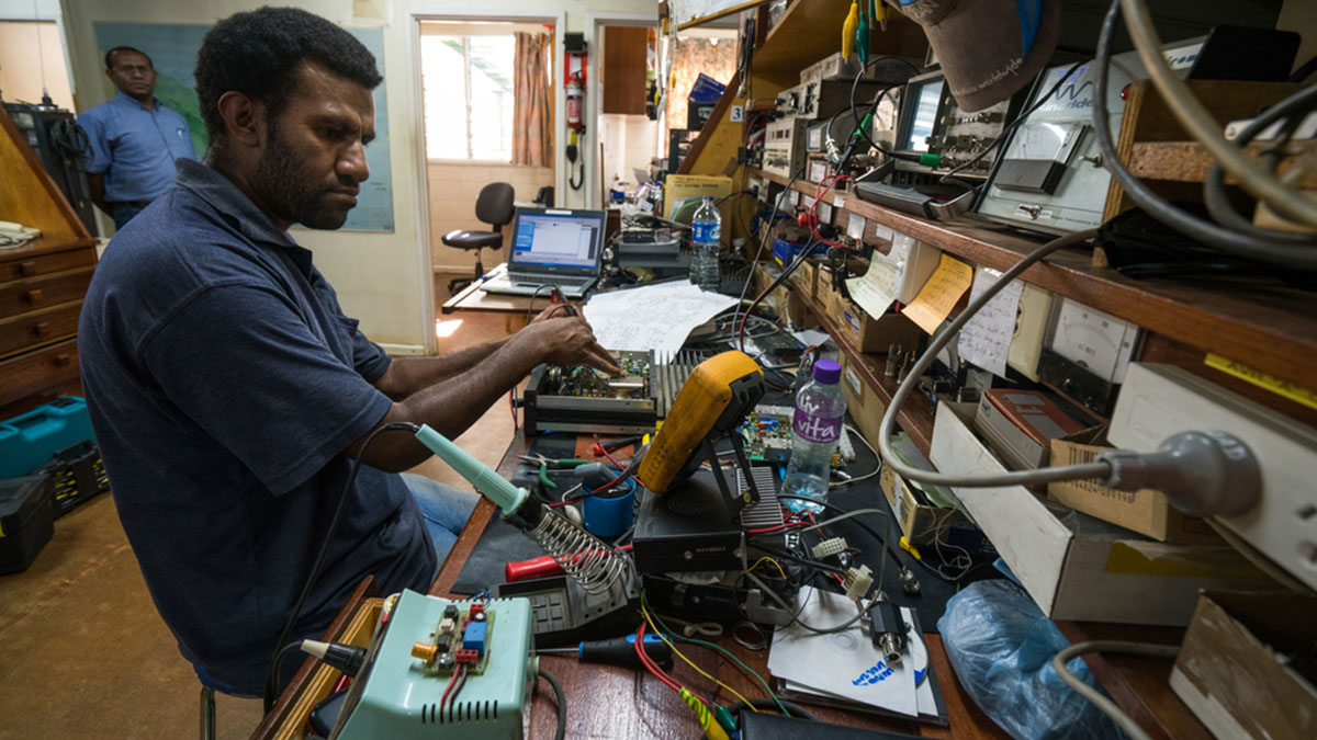 MAF Radio Engineer, David Feka, repairing radios in Goroka