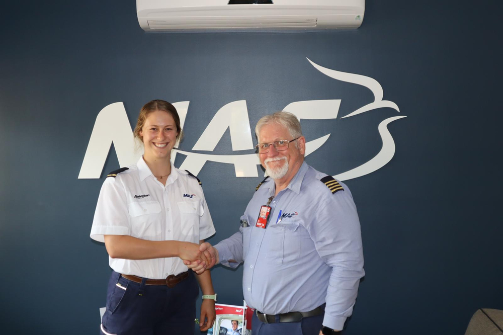 Marcus awards Abigail Duff her epaulettes for passing her Private Pilot License (credit: Erwin Jungen)