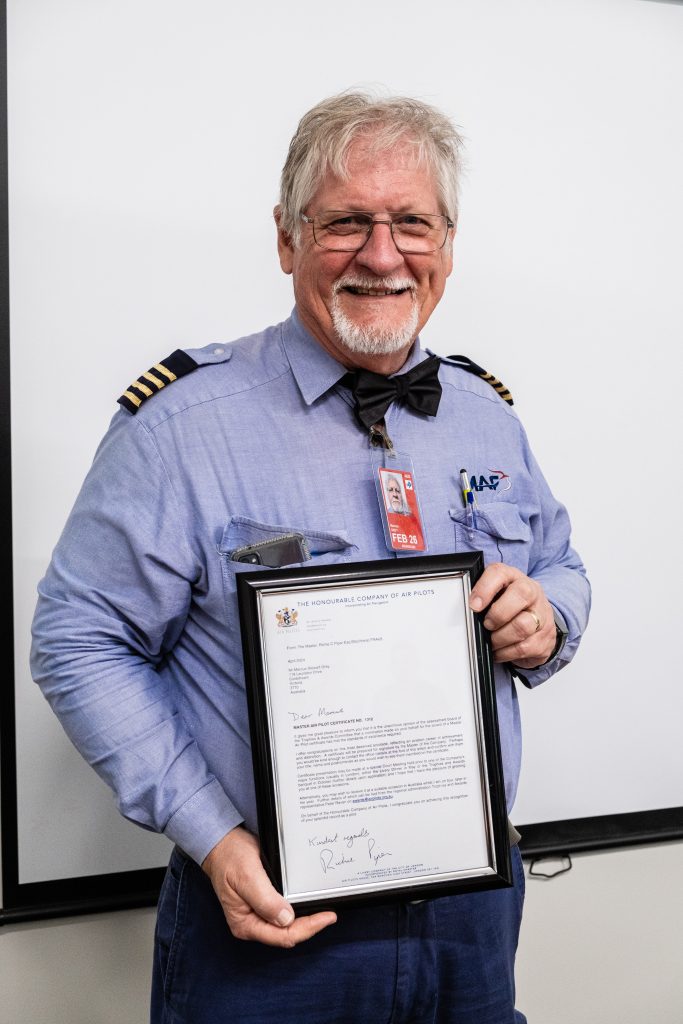 Marcus proudly holds his framed ‘Master Air Pilot’ certificate (credit: Janne Rytkonen)