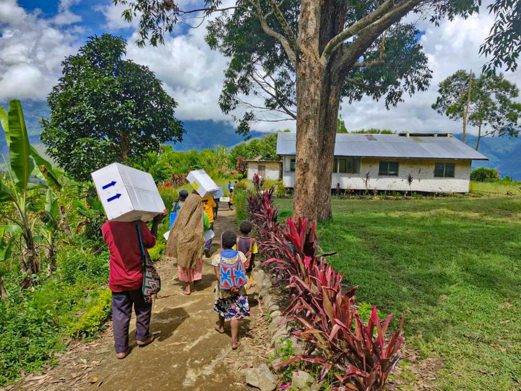 Locals take the medical supplies to Sindeni Clinic (credit: Kowara Bell)