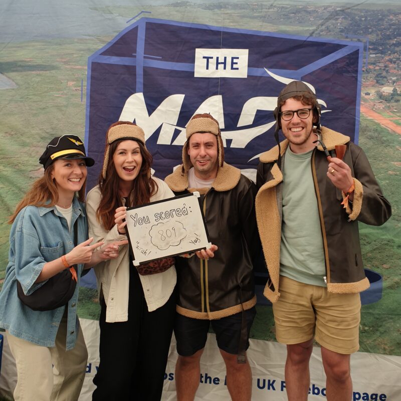 Four young people pose for a photo in aviation themed fancy dress.