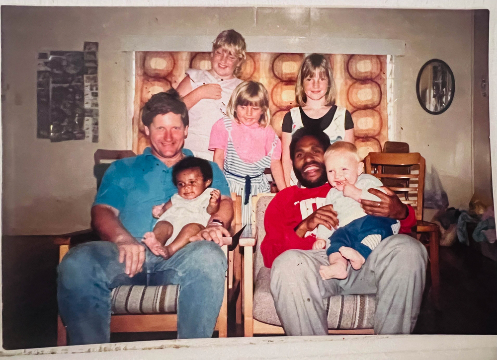 1988: Marcus holds baby Esther & her father, David, holds Marcus’ son (credit: Esther Dii)