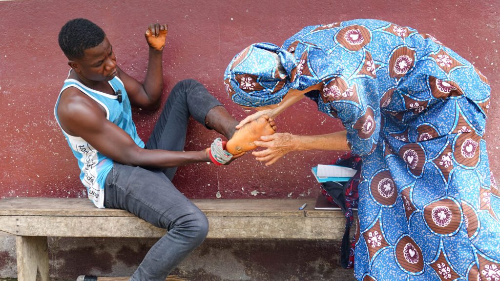 Dr Martha Gafafer treats Norbert at CHRS Hospital in Guinea (credit: Joel Conte)