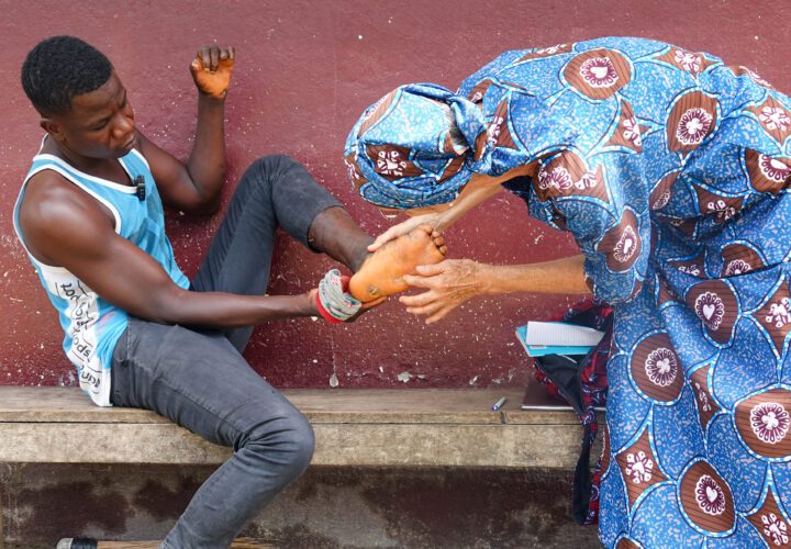 Dr Martha Gafafer treats Norbert at CHRS Hospital in Guinea (credit: Joel Conte)