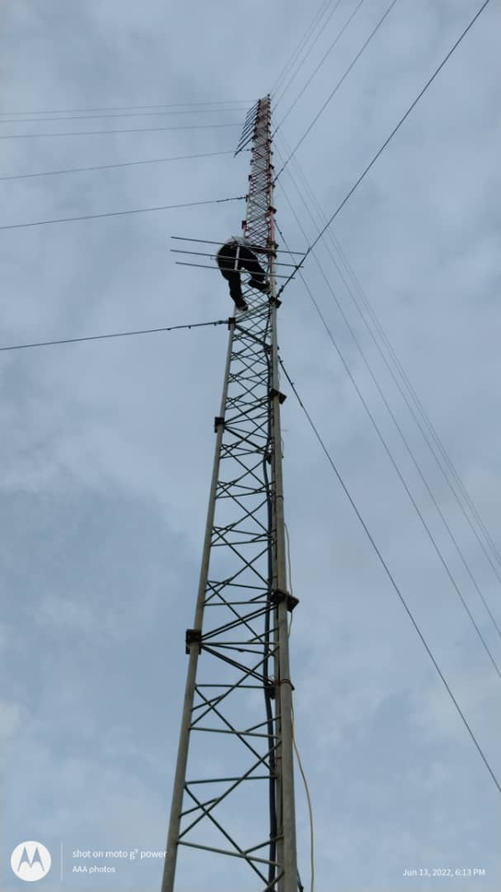 An engineer fixes the radio tower at Tonj (credit: Jenny Davies)