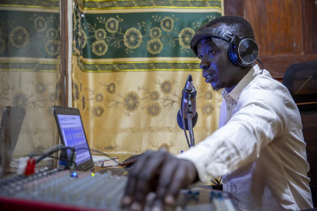 A presenter at Döör 99.9 FM which has been broadcasting to Tonj since 2012 (credit: Dave F)