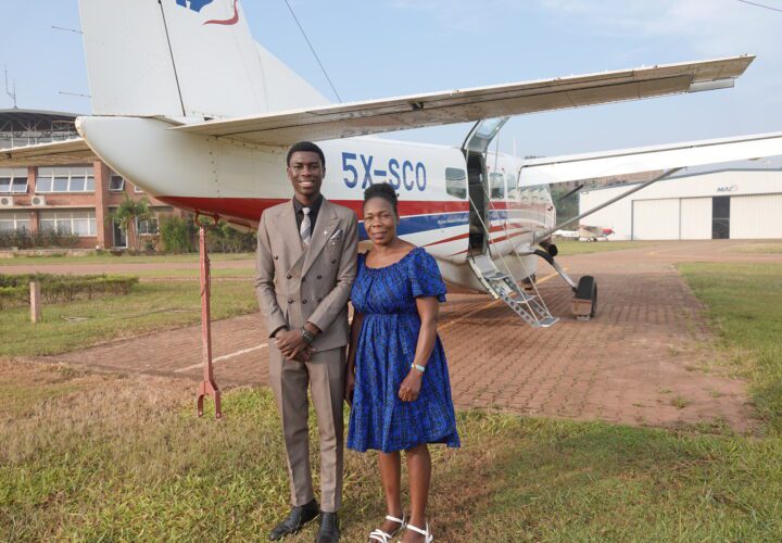 Daniel and mum Sentina in front of MAF plane at Kajjansi Airfield in Uganda (credit: Damalie Hirwa)