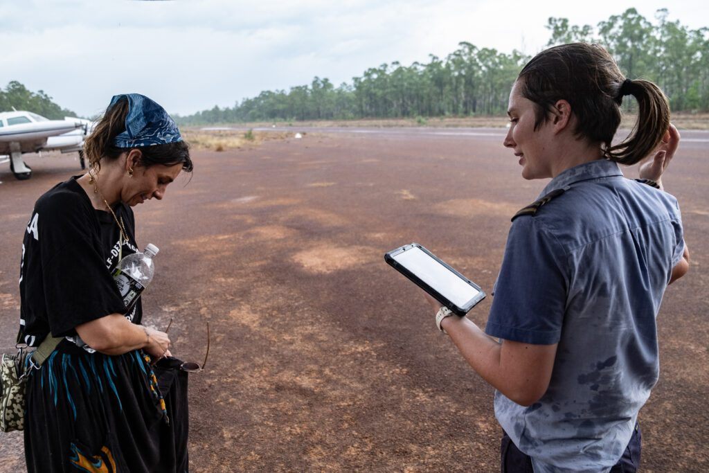 Drenched MAF pilot Mel Higgins at Gan Gan Homeland Airstrip (credit: Janne Rytkonen)