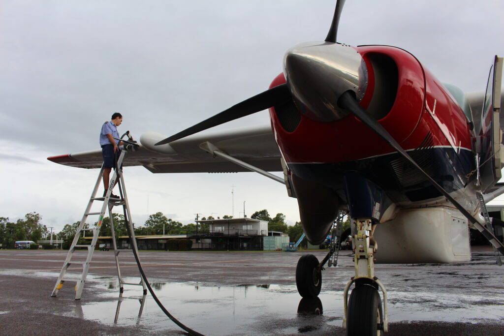 MAF Pilot Philipp Techand refuels one of the C208 Caravans in Arnhem Land (credit: Joshua Oliver)