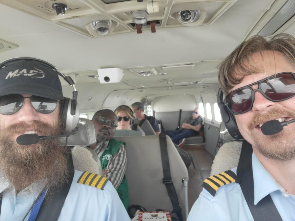 MAF Pilot Alfred Ottosson (R) flies a multi-agency crisis team from Entebbe, Uganda (credit: MAF US) 