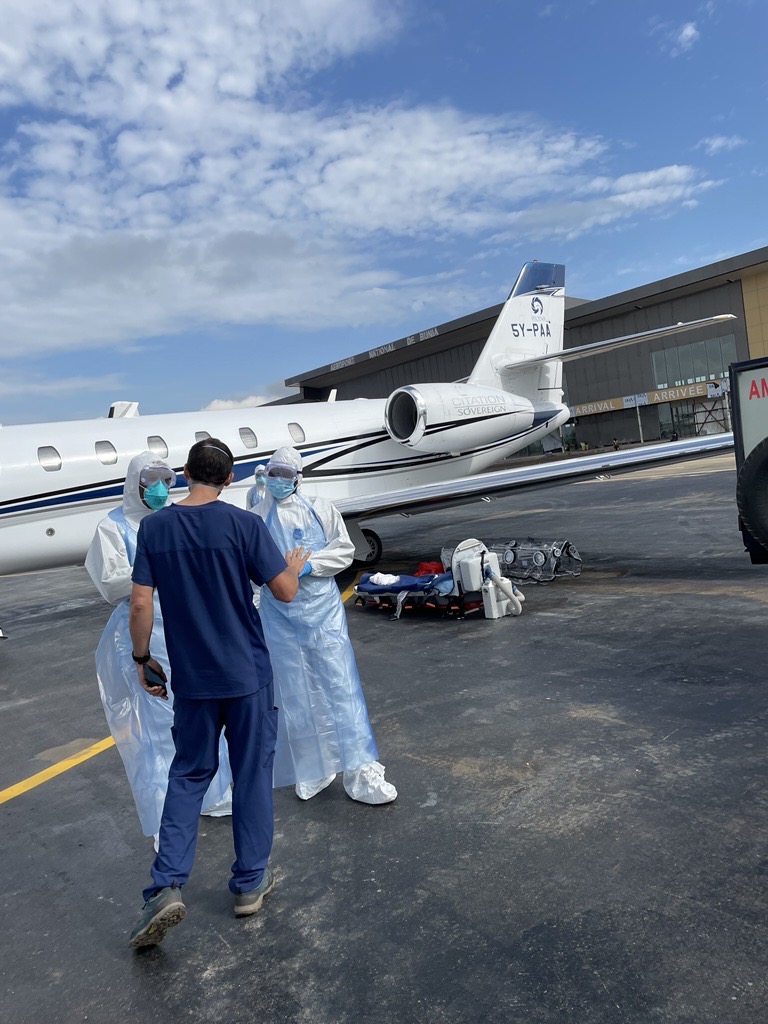 Dr LaRochelle (dark blue) about to board an international flight to Prague for treatment (credit: MAF US)