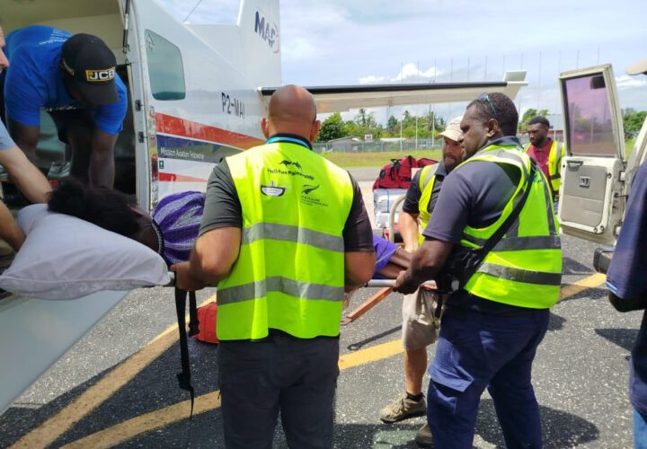 An expectant mother is medevacked to hospital on Buka Island (credit: John Woodberry)