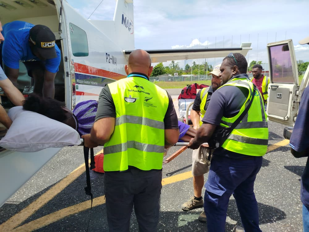 An expectant mother is medevacked to hospital on Buka Island (credit: John Woodberry)