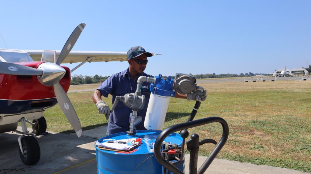 MAF’s Yohanes da Costa Silva refuels MAF’s plane in Timor-Leste (credit: Lobitos Alves)